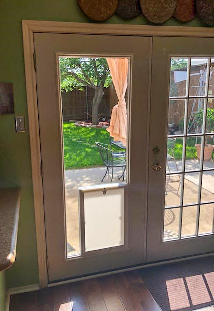 pet door inside french door glass